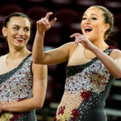 Senior, Katie Alsheskie (left) and senior, Kendall Diviney cheer and wave to the crowd while they are introduced to the audience during the Central Michigan University Dance Team's nationals showcase in MaGuirk Arena, Sunday, April 8, 2018.