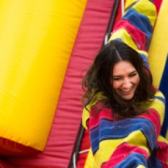Brighton sophomore, Hayley Baerwalde hangs from the velcro wall during Central Michigan University's annual Maroonzie outside Wariner Hall, Friday, April 27, 2018.