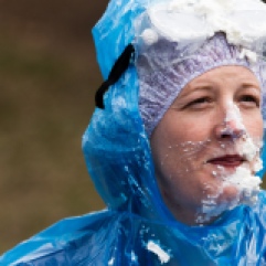 Director of Residence Life, Kathleen Gardner gets pied in the face during Central Michigan University's annual Maroonzie outside Wariner Hall, Friday, April 27, 2018.